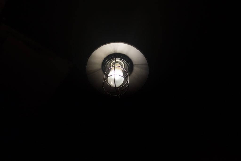 an-old-lamp-inside-a-darkroom-Z5QERPF-scaled